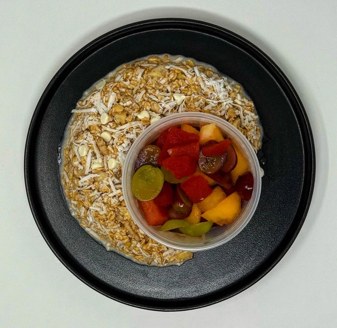 Delicious Banana protein oatmeal infused with coconut, banana, and vanilla yogurt chips paired with a fresh fruit salad - Rutherford NJ Halal Meals