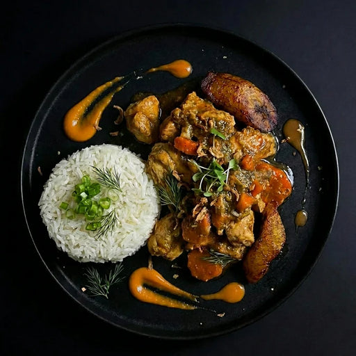 Plated dish with rice, fried chicken, and vegetables on a dark background. The Halal Meal Preps