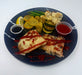 Plated dish with pizza, vegetables, and sauces on a blue plate. A Meal Made By The Halal Meal Preps.